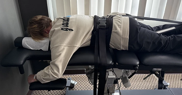 Close up of patient laying on spinal decompression table