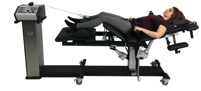 A padded, adjustable therapy table with multiple segmented cushions